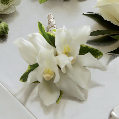 White Mini Cymbidium Boutonniere –  Rosewood Flower Shop, Humble TX